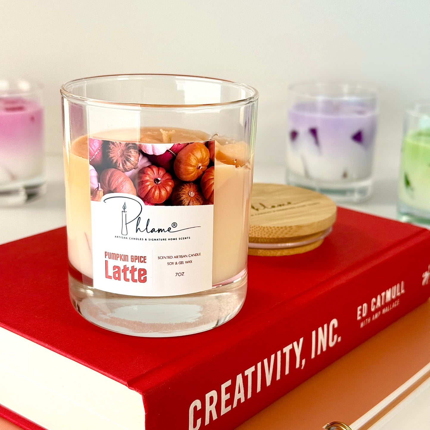 Pumpkin Spice Latte Candle with layered orange wax and gift packaging, styled for autumn ambiance