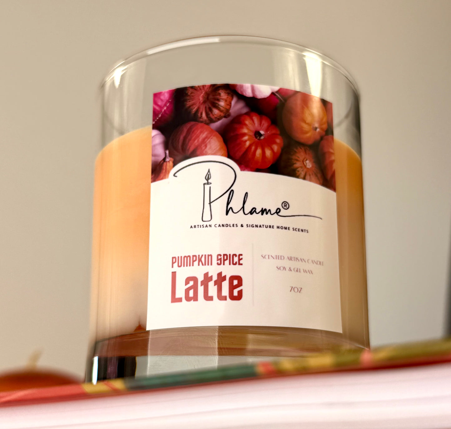 Pumpkin Spice Latte Candle with layered orange wax and gift packaging, styled for autumn ambiance