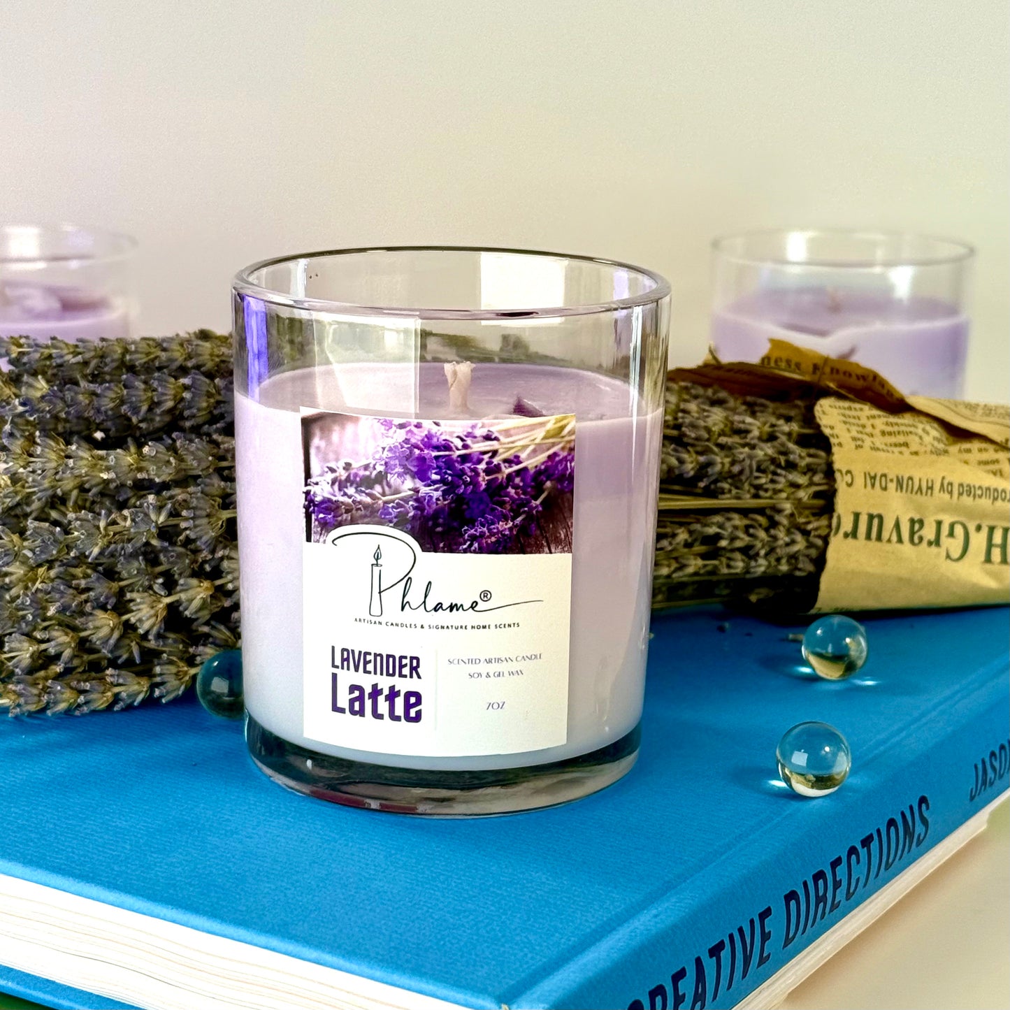 Lavender Latte Candle with layered wax in glass jar and bamboo lid, styled for gift-ready presentation