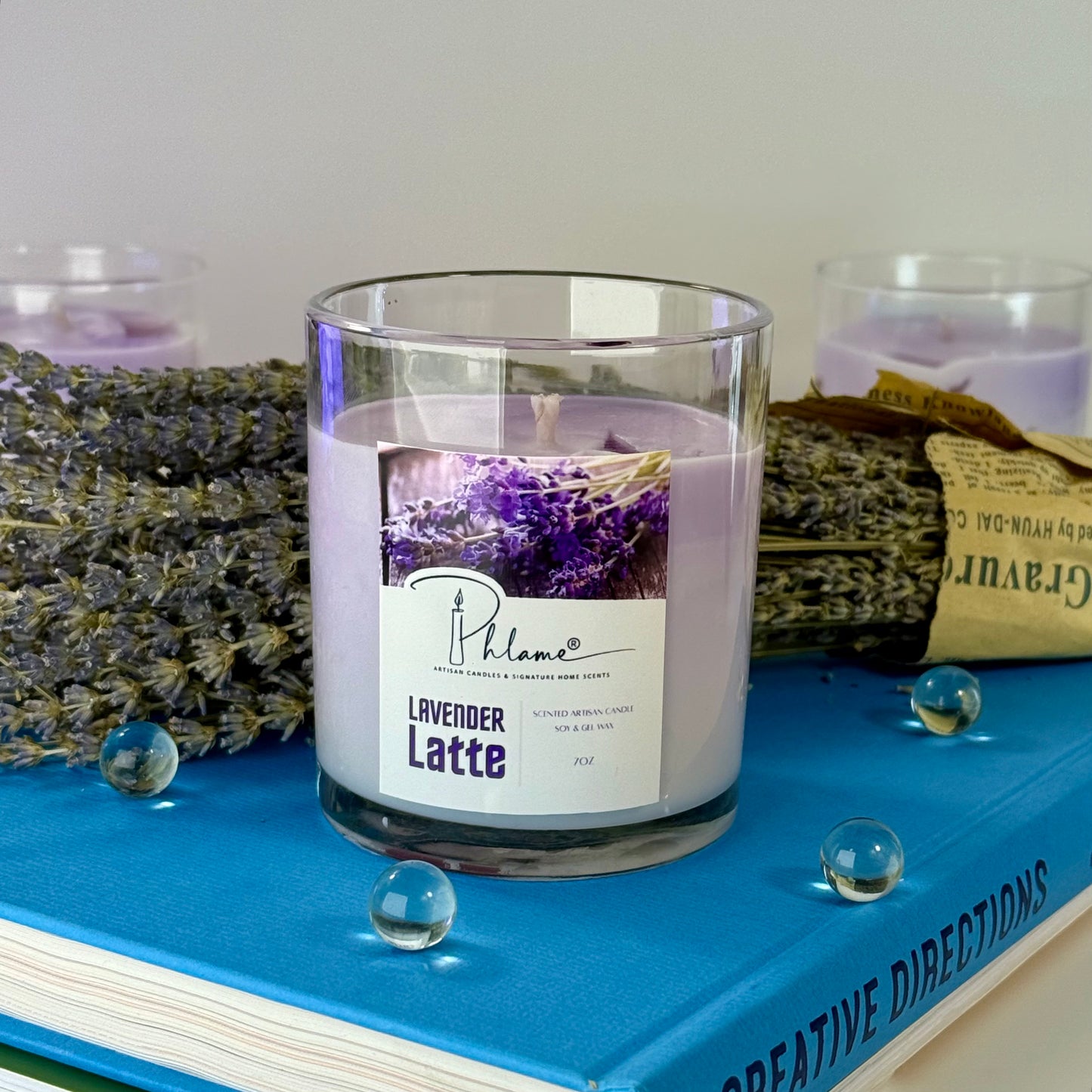 Lavender Latte Candle with layered wax in glass jar and bamboo lid, styled for gift-ready presentation