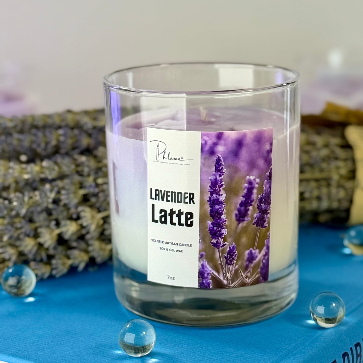 Candle labeled 'Lavender Latte' with lavender flowers in the background
