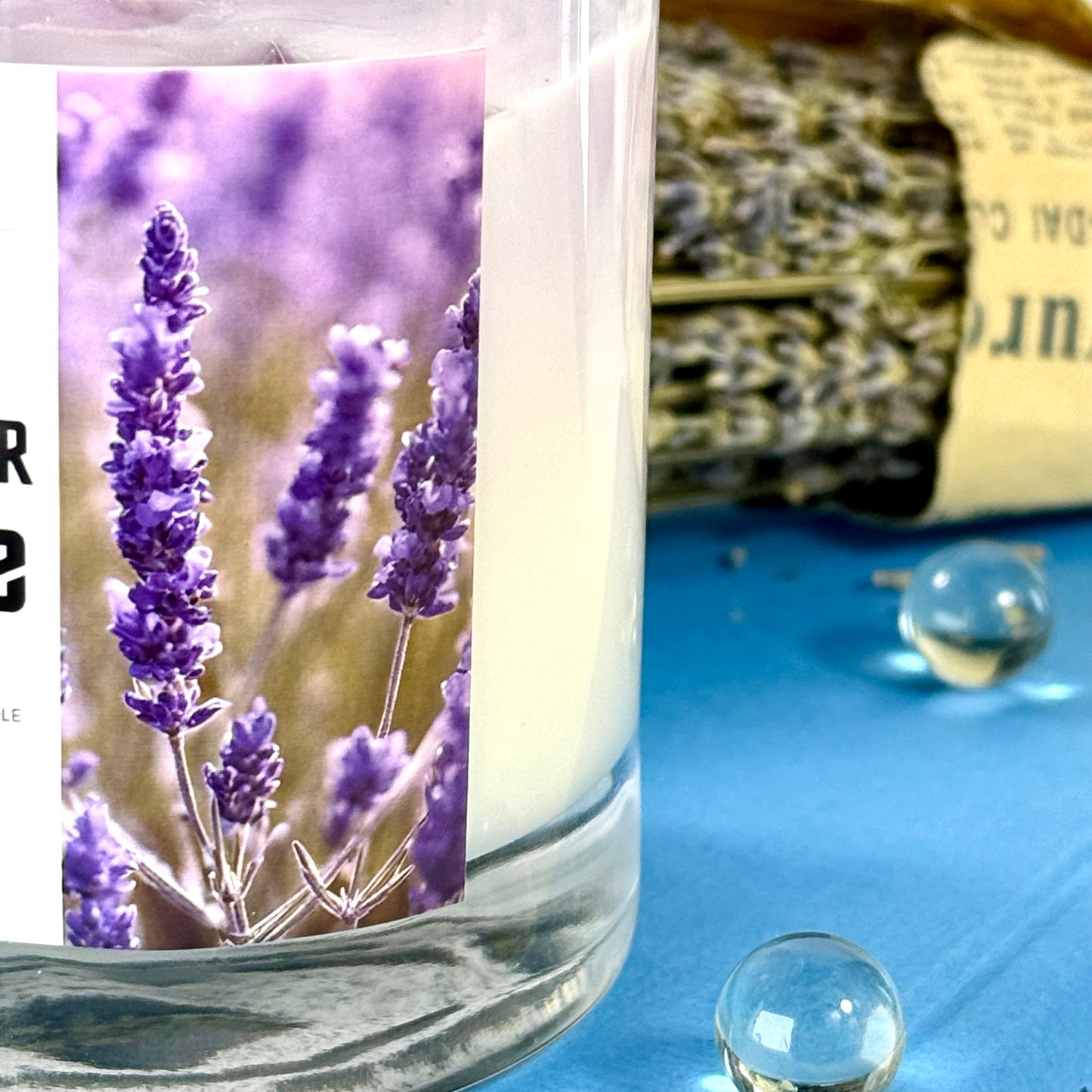 Lavender Latte Candle with layered wax in glass jar and bamboo lid, styled for gift-ready presentation
