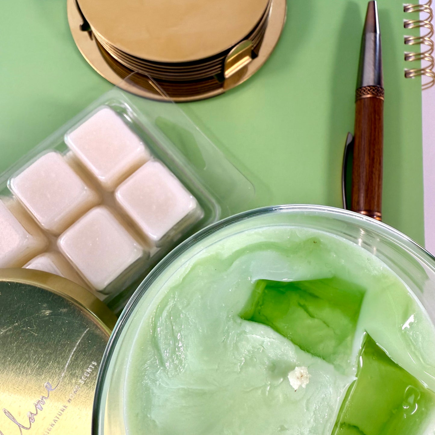 Matcha Latte Candle with green wax layers and lid, ideal for wellness and self-care gifts