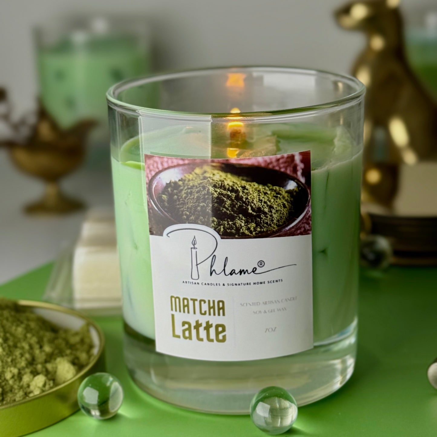 Matcha Latte candle with a label on a green surface