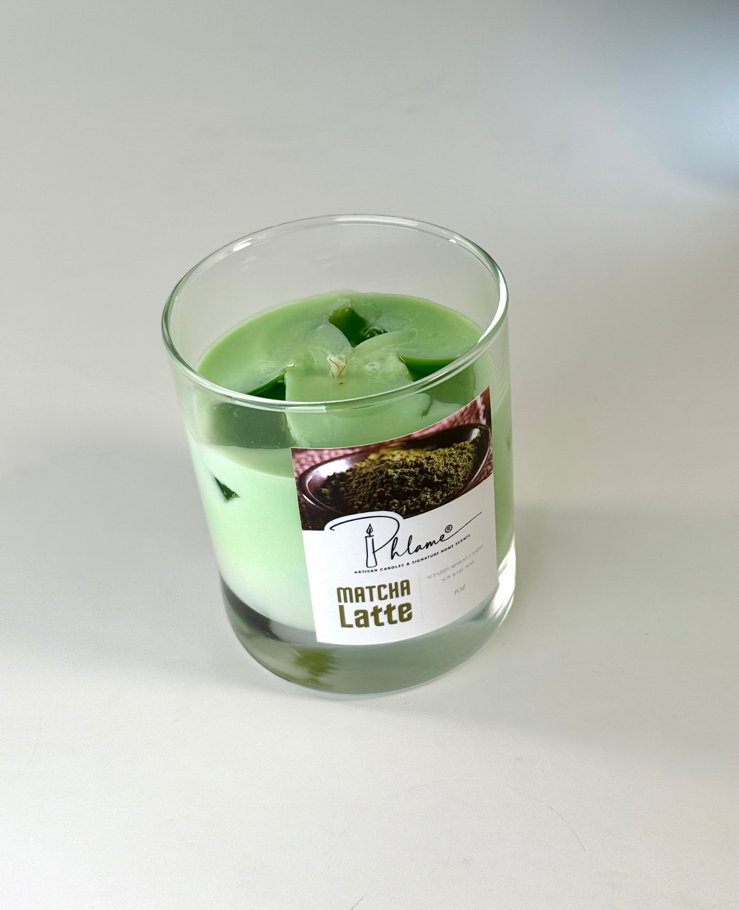 Matcha Latte Candle with green wax layers and lid, ideal for wellness and self-care gifts