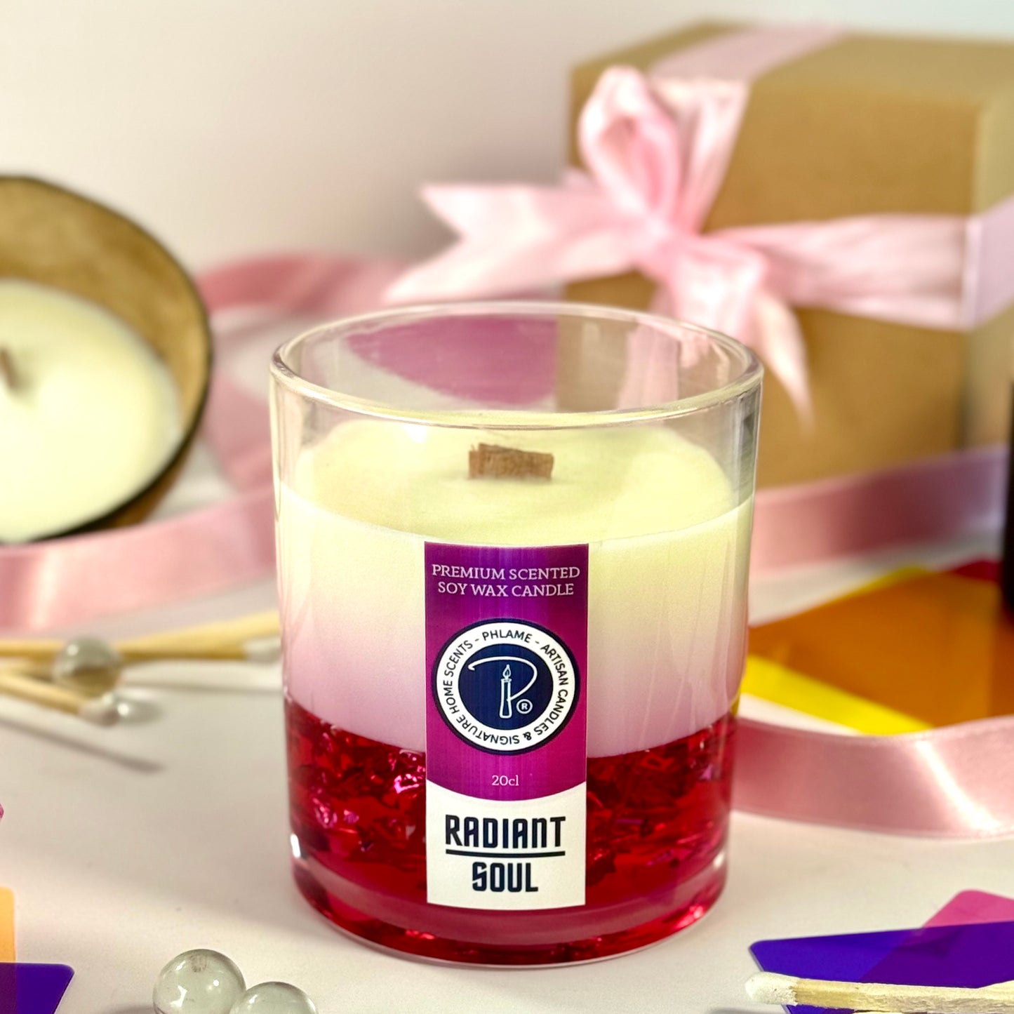 Radiant Soul candle with red gel wax and wooden wick, displayed in gift setting