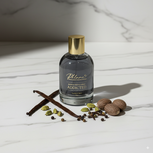 Addicted Vanille & Tabac Noir room and textile spray in black bottle with gold cap.