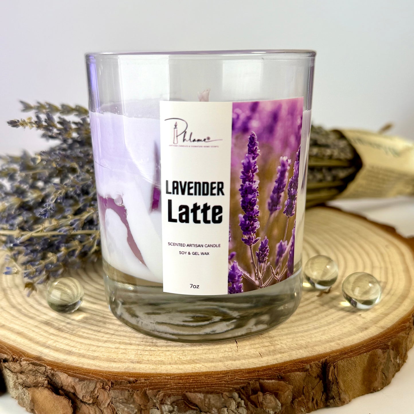 Lavender Latte candle with a label on a wooden surface