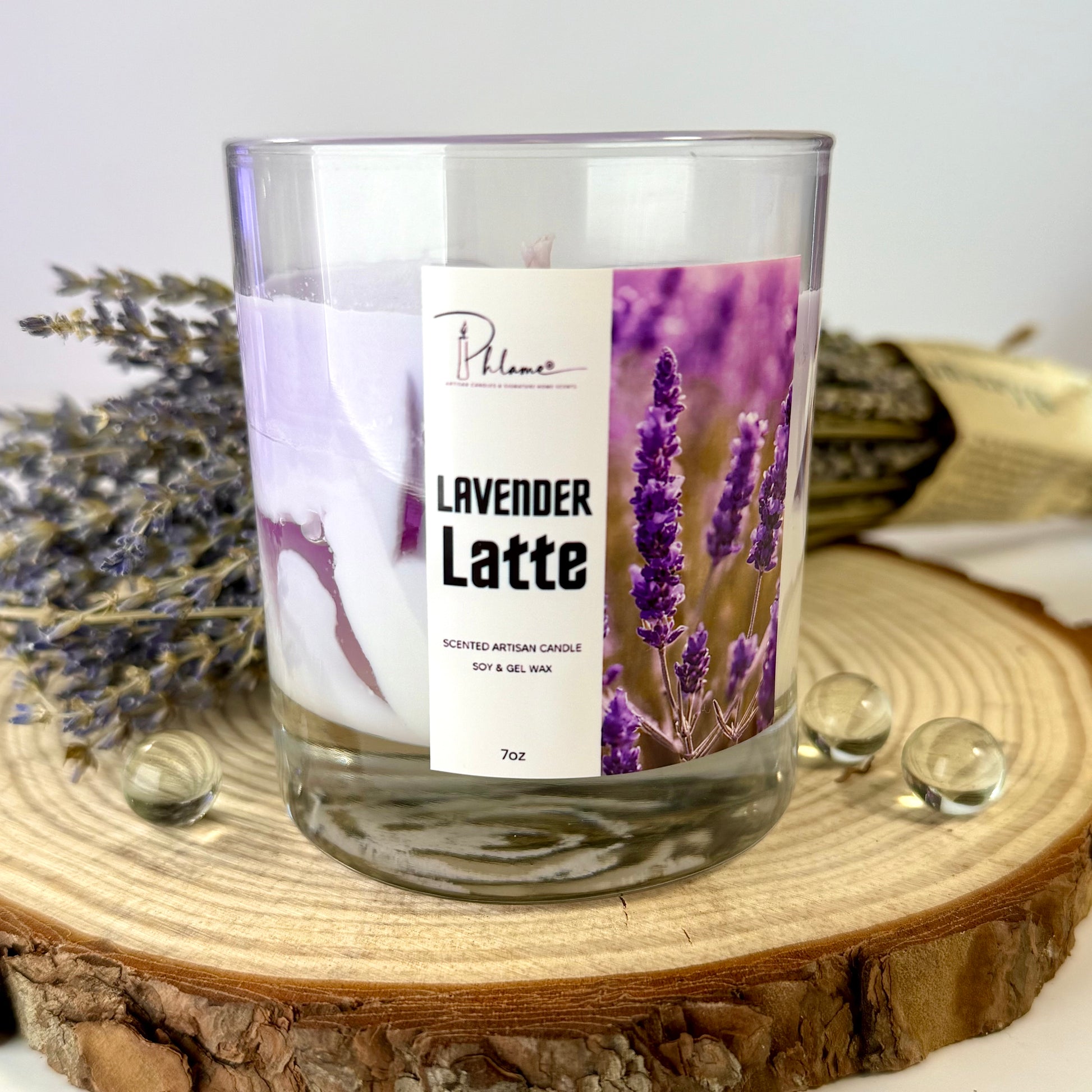 Lavender Latte candle with a label on a wooden surface