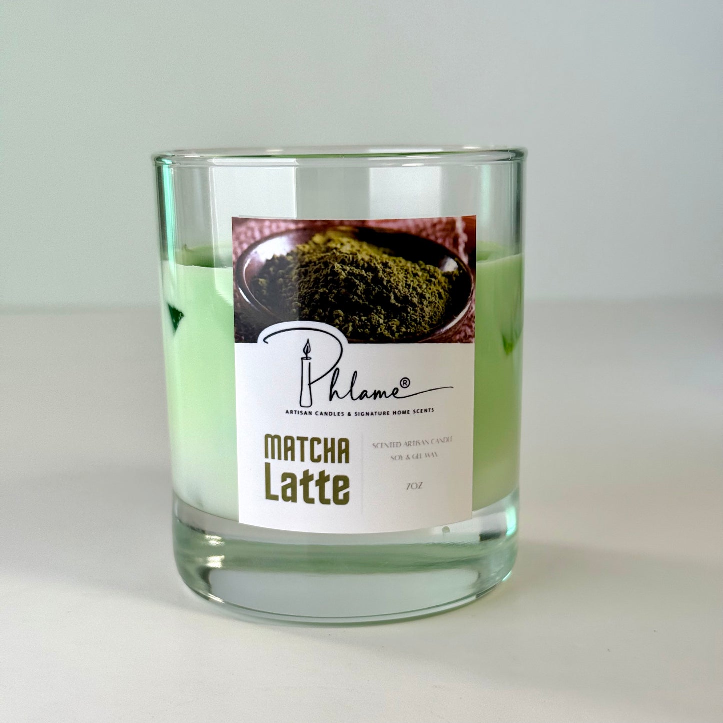 Matcha Latte Candle with green wax layers and lid, ideal for wellness and self-care gifts
