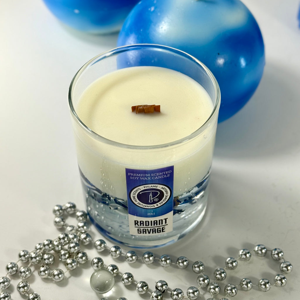 Radiant Savage candle with blue wax detail and black gift box, styled with cool-toned décor.