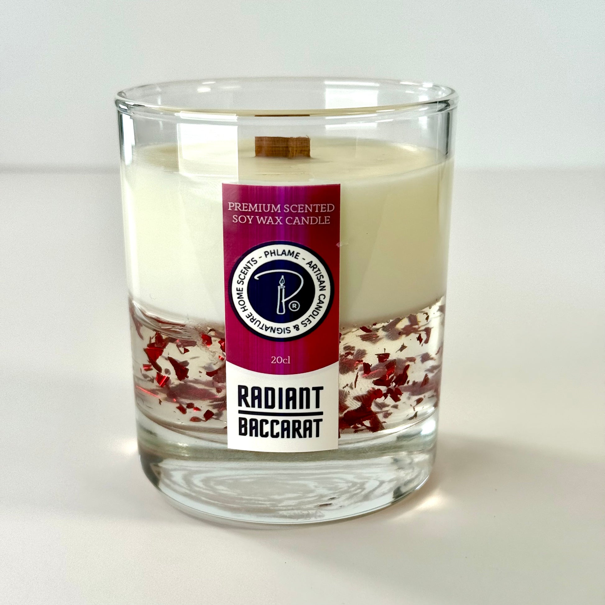 Radiant Baccarat candle with red gel wax and elegant black box, styled for luxury.