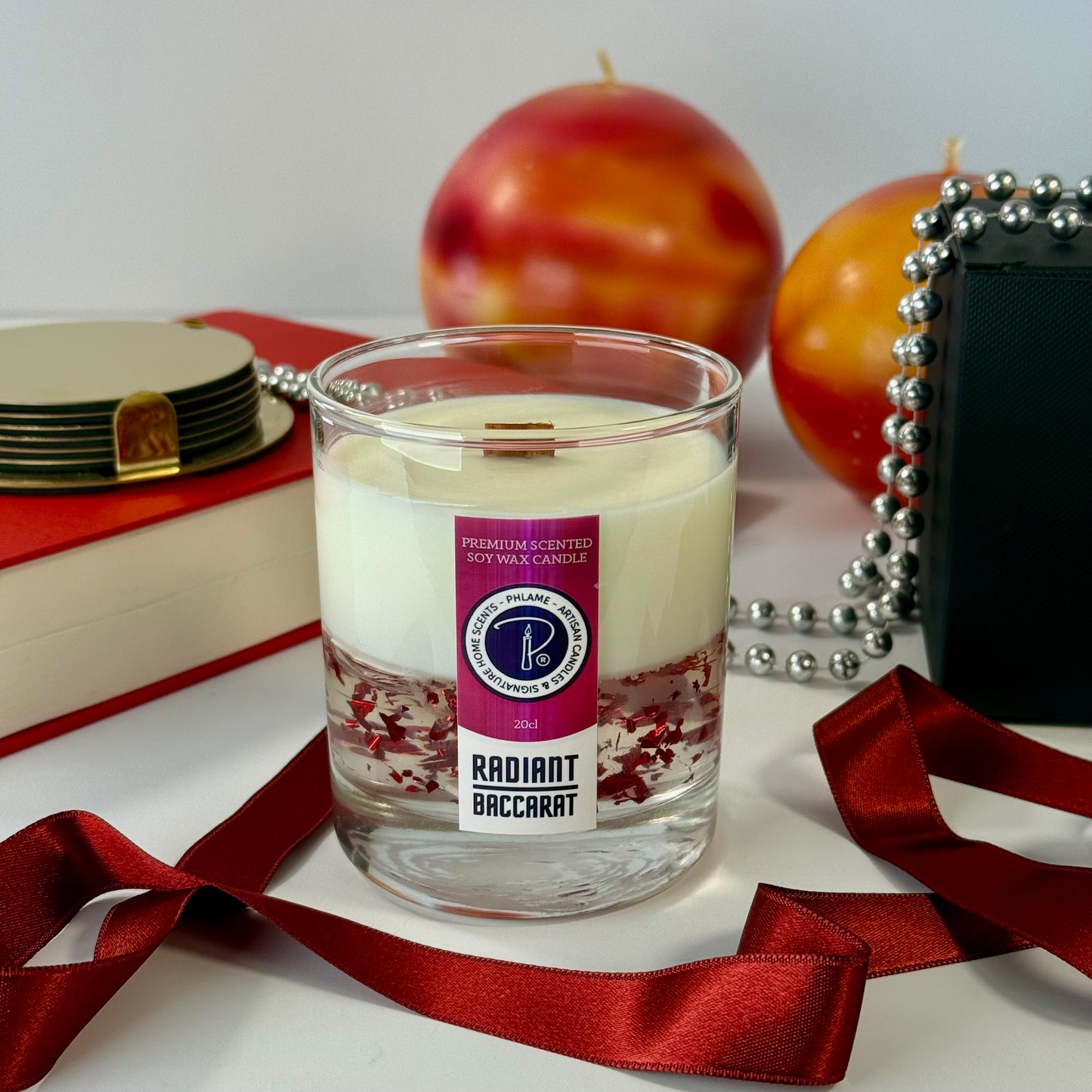 Radiant Baccarat candle with red gel wax and elegant black box, styled for luxury.