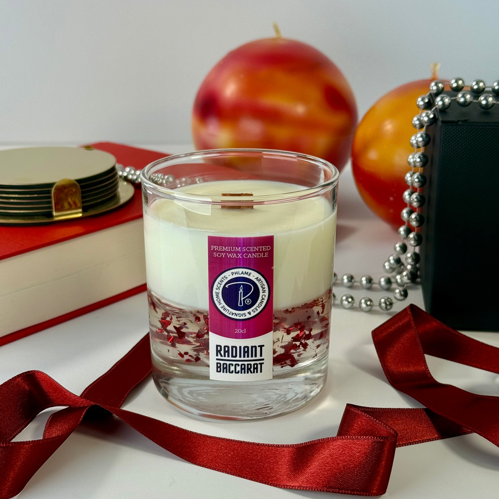 Radiant Baccarat candle with red gel wax and elegant black box, styled for luxury.