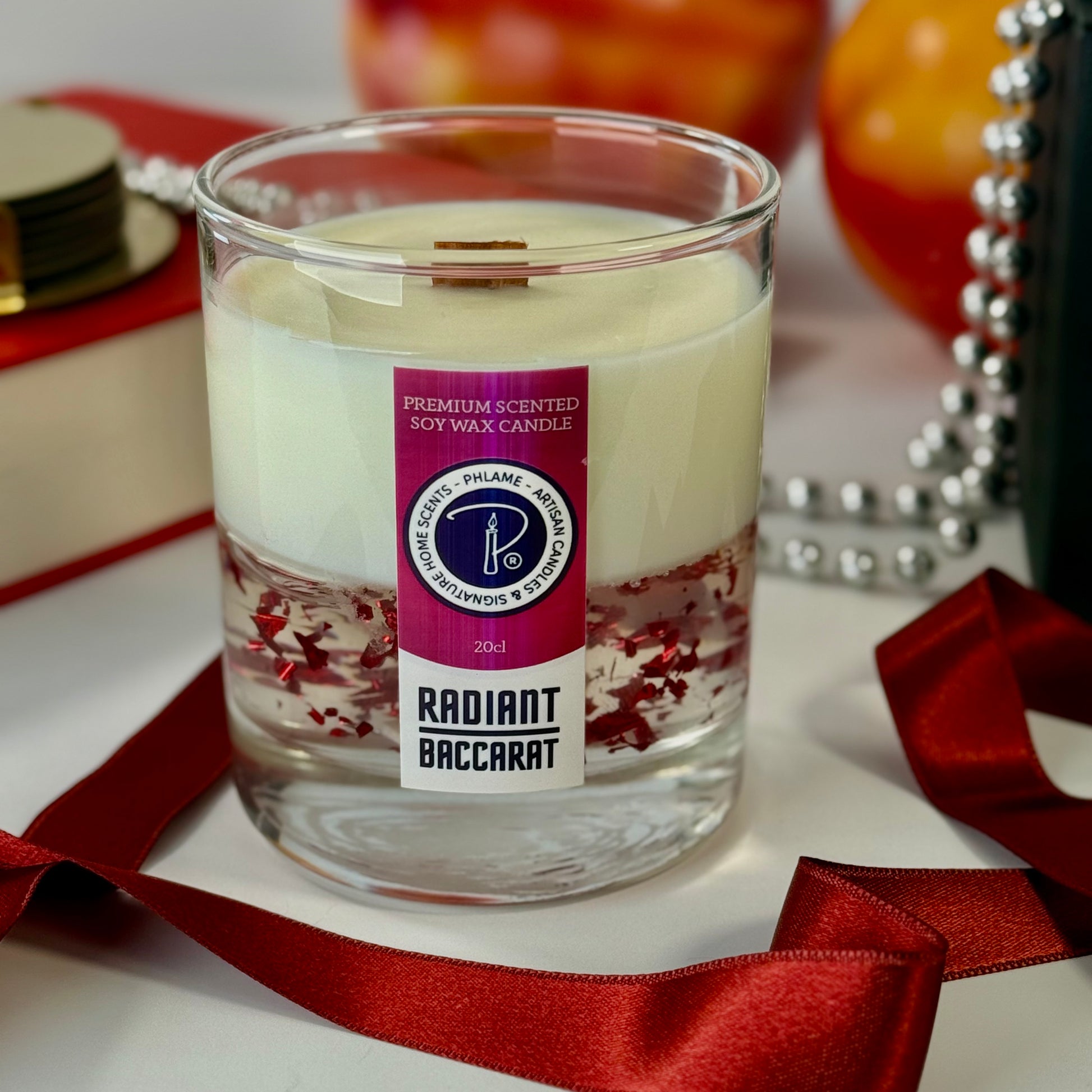 Radiant Baccarat candle with red gel wax and elegant black box, styled for luxury.