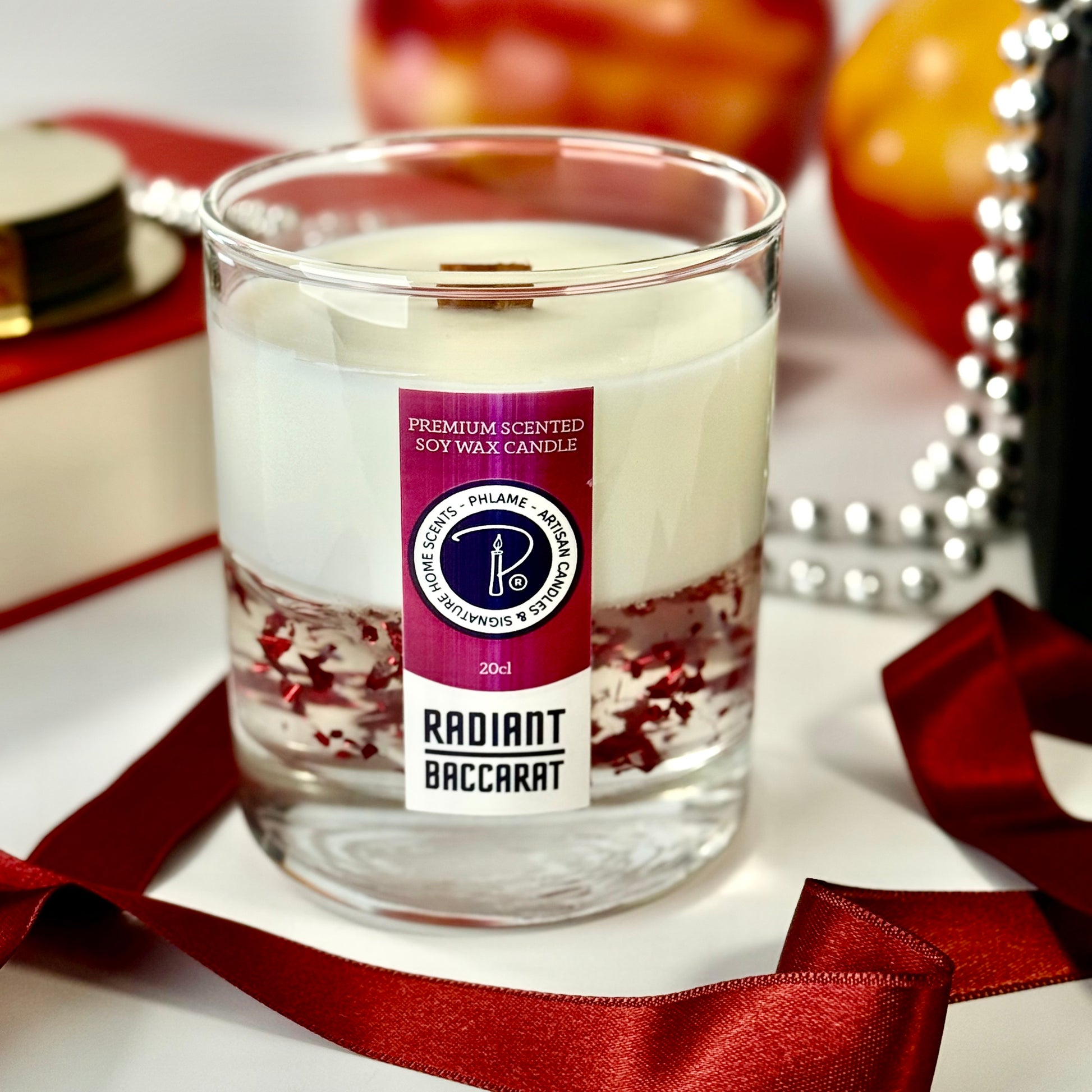 Radiant Baccarat candle with red gel wax and elegant black box, styled for luxury.