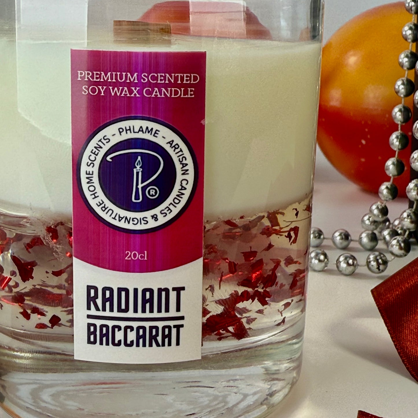 Radiant Baccarat candle with red gel wax and elegant black box, styled for luxury.