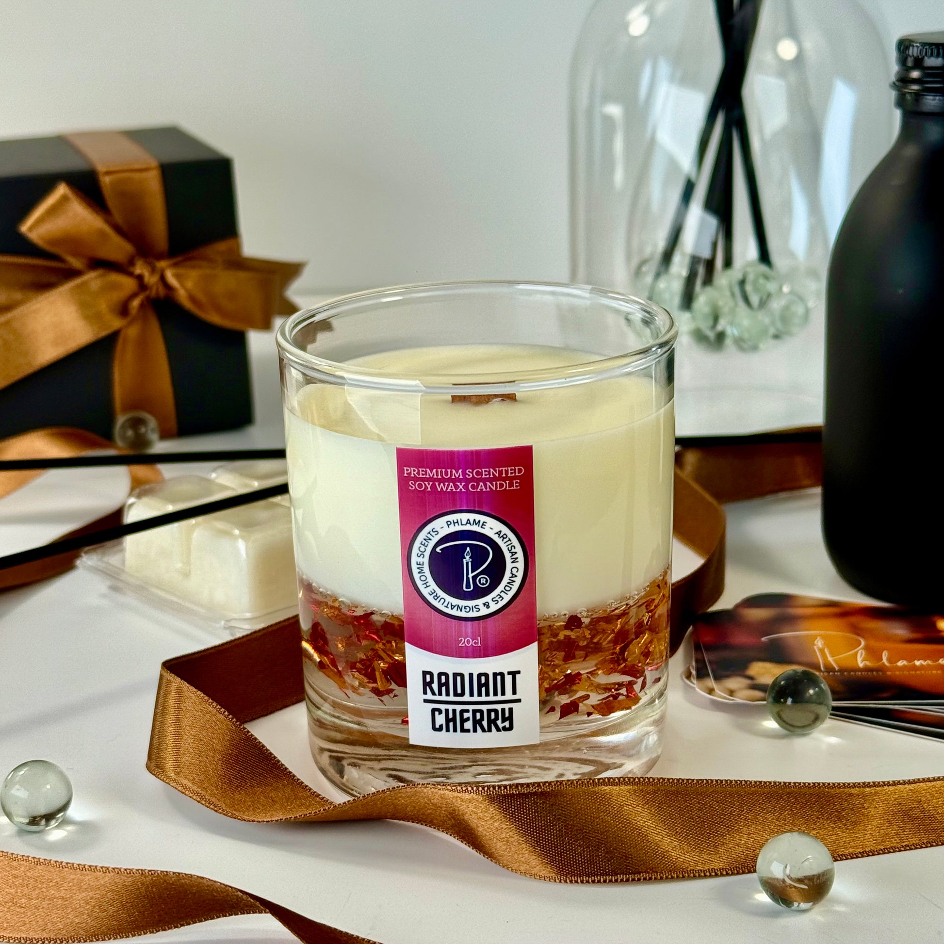 Radiant Cherry candle with shimmering red wax and gift-ready presentation.