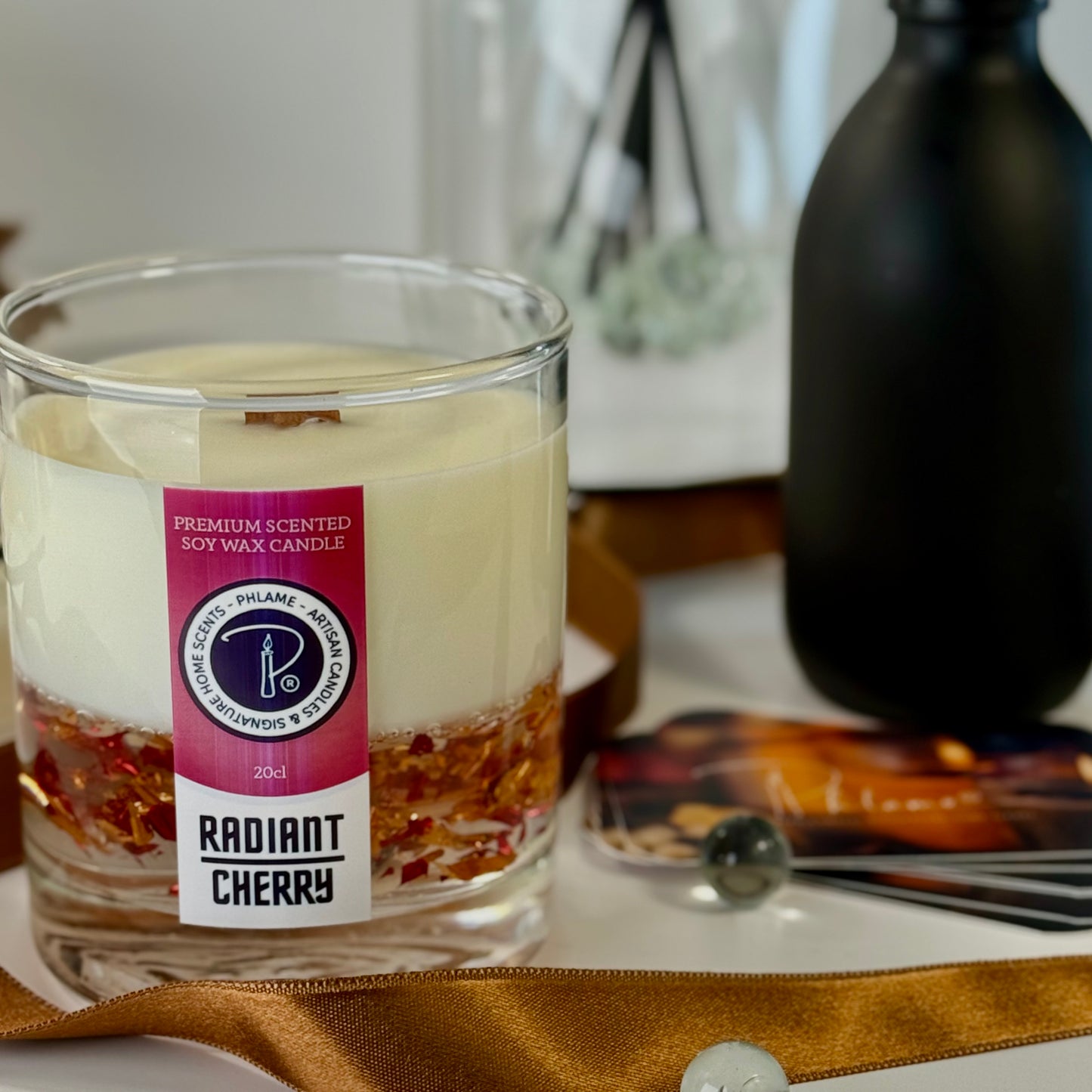 Radiant Cherry candle with shimmering red wax and gift-ready presentation.