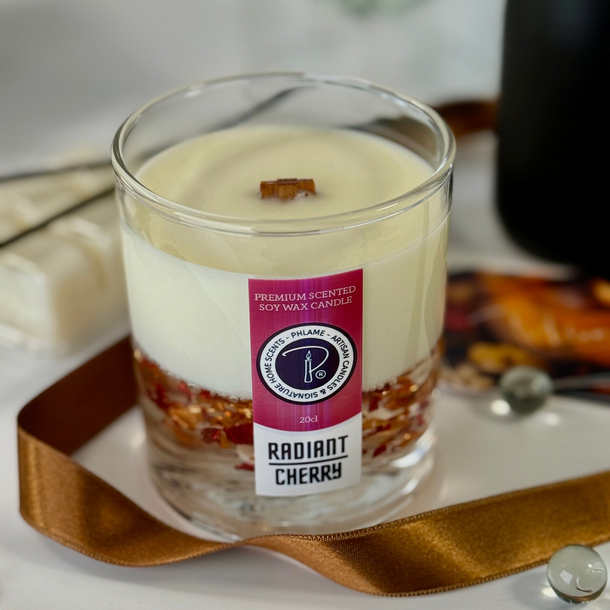 Radiant Cherry candle with shimmering red wax and gift-ready presentation.