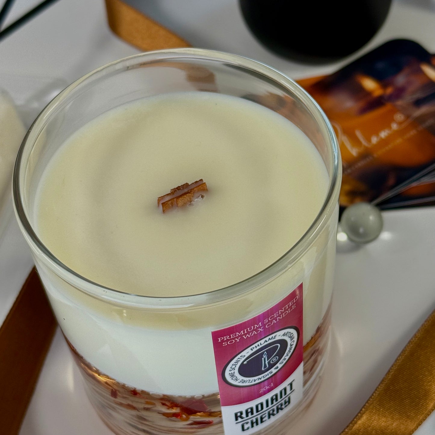 Radiant Cherry candle with shimmering red wax and gift-ready presentation.