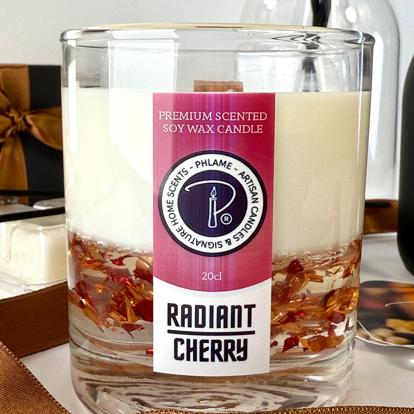 Radiant Cherry candle with shimmering red wax and gift-ready presentation.