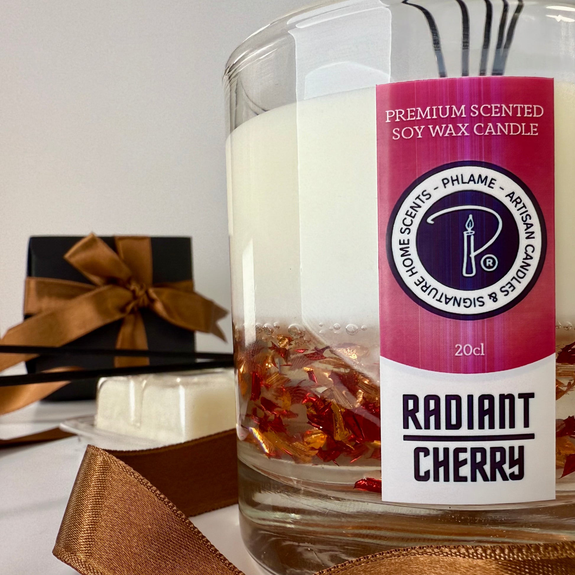 Radiant Cherry candle with shimmering red wax and gift-ready presentation.