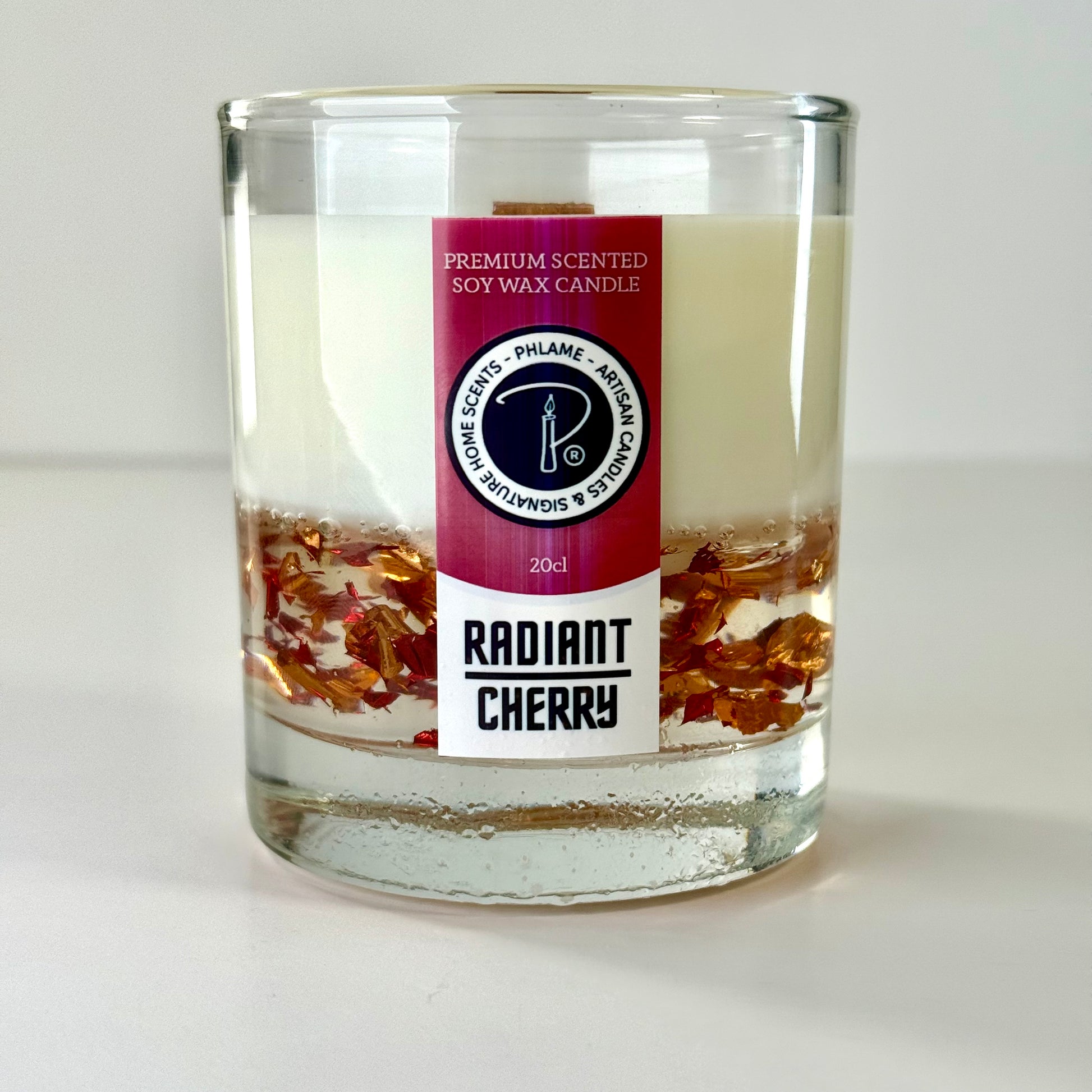 Radiant Cherry candle with shimmering red wax and gift-ready presentation.