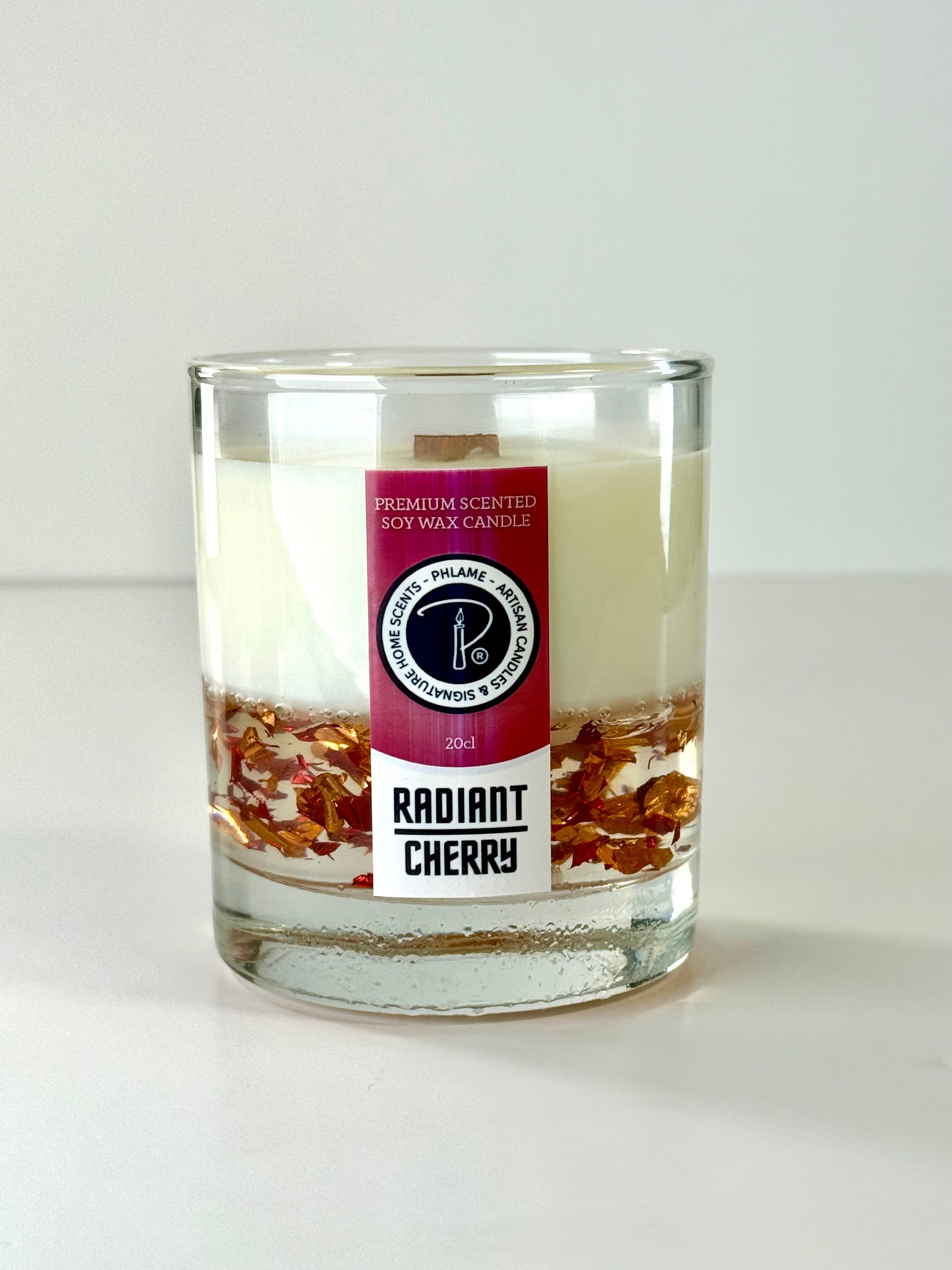 Radiant Cherry candle with shimmering red wax and gift-ready presentation.