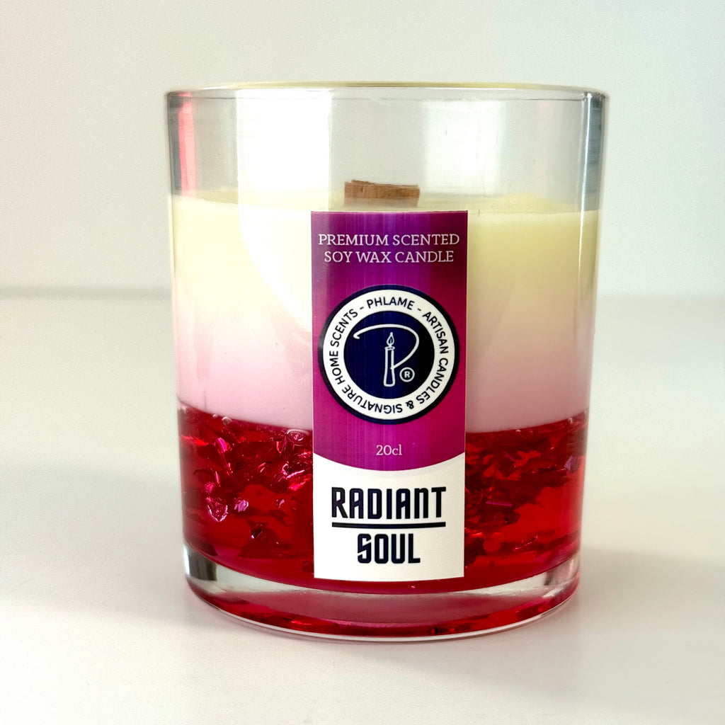 Radiant Soul candle with red gel wax and wooden wick, displayed in gift setting.