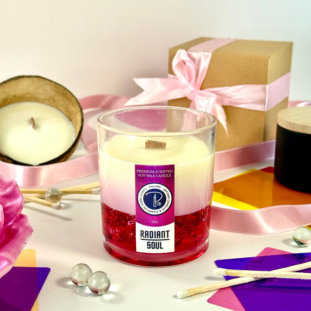 Radiant Soul candle with red gel wax and wooden wick, displayed in gift setting.