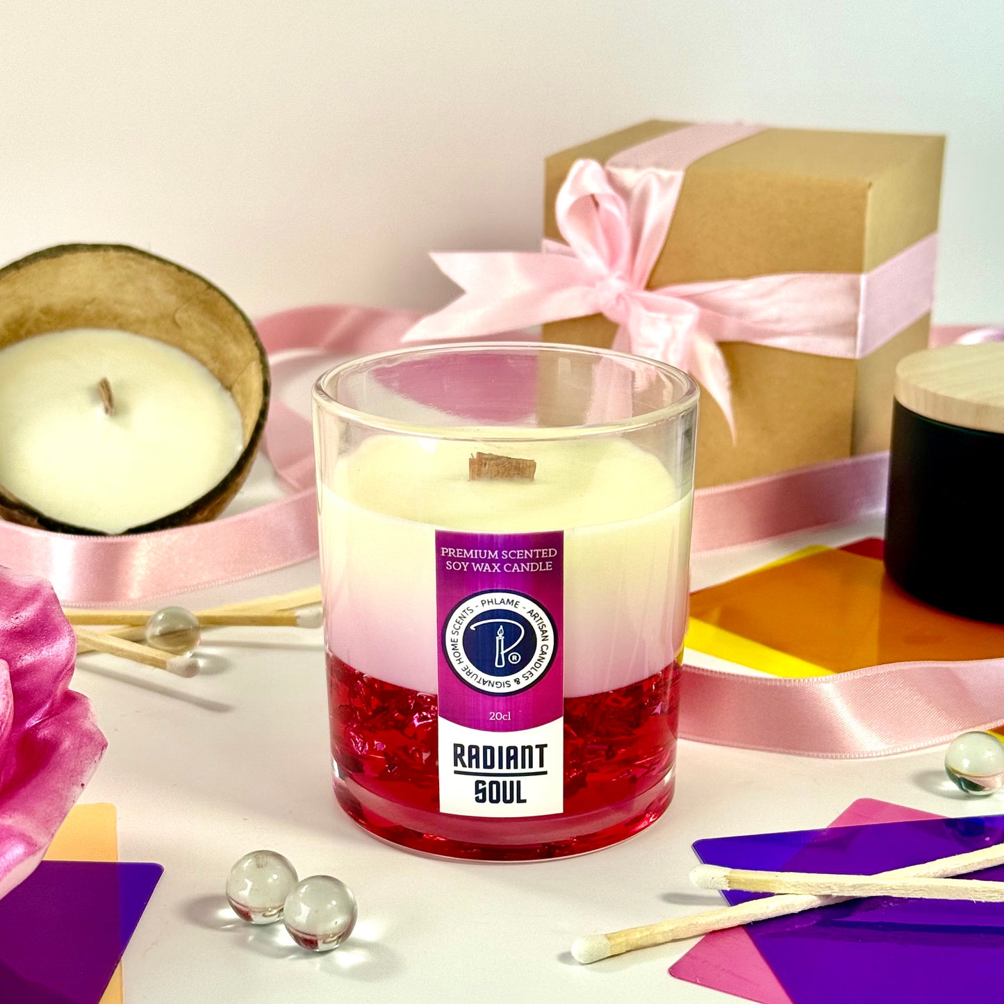 Radiant Soul candle with red gel wax and wooden wick, displayed in gift setting.