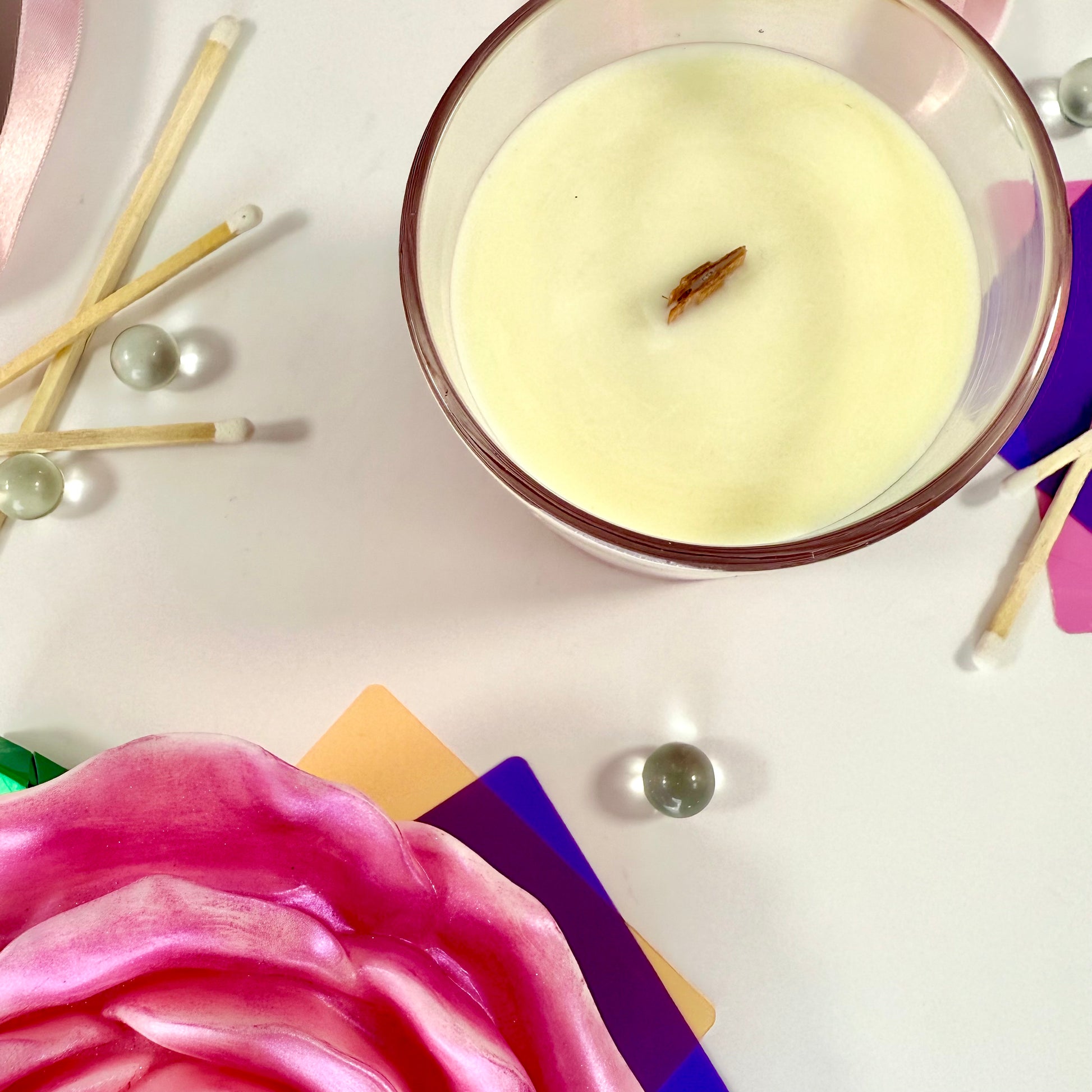 Radiant Soul candle with red gel wax and wooden wick, displayed in gift setting.