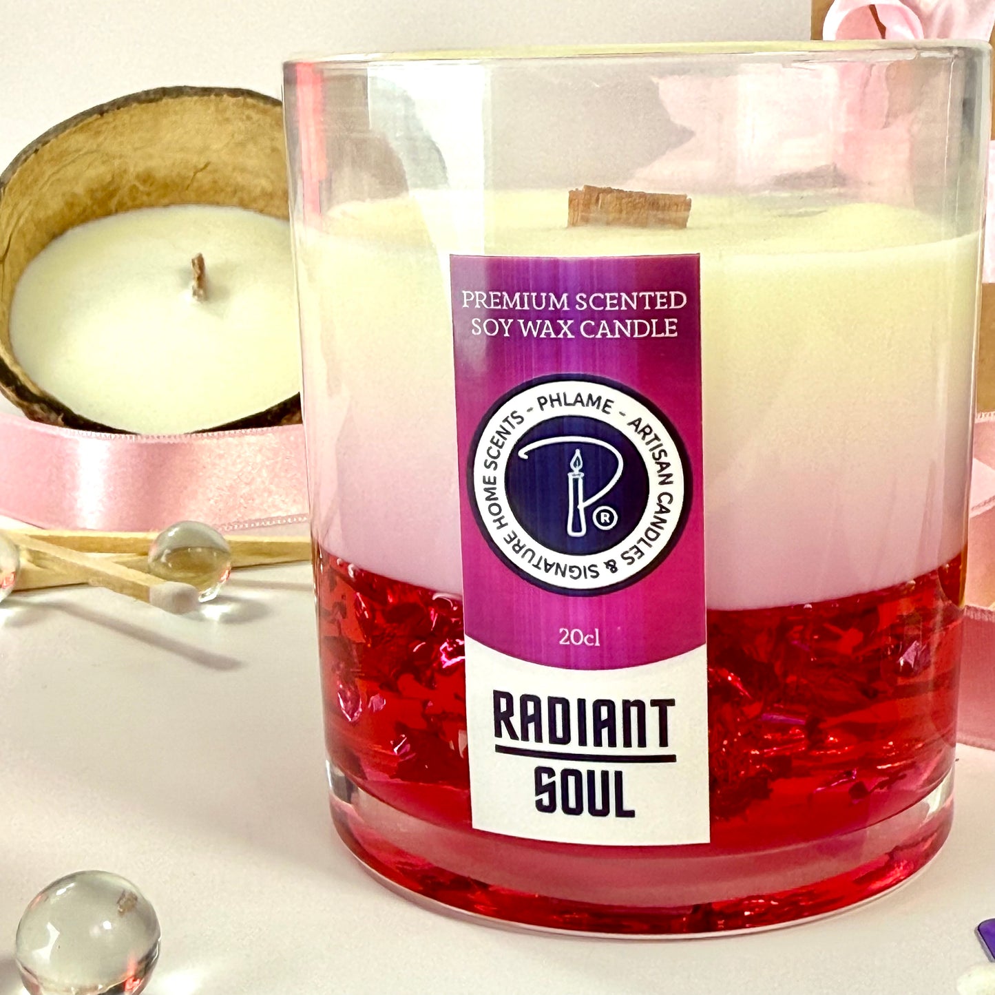 Radiant Soul candle with red gel wax and wooden wick, displayed in gift setting.