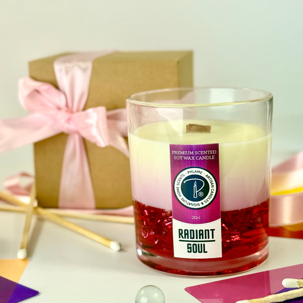 Radiant Soul candle with red gel wax and wooden wick, displayed in gift setting.