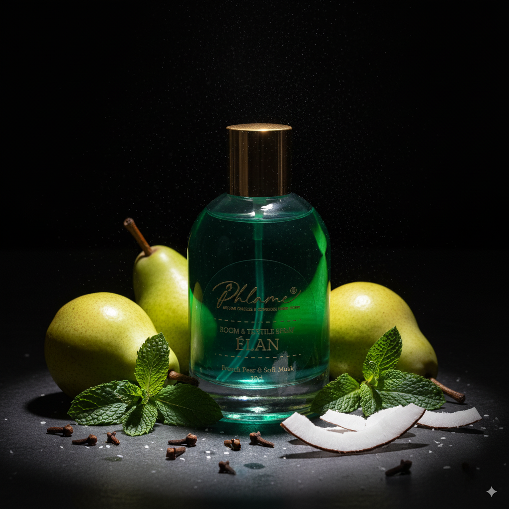Bottle of Phlame room and textile spray with pears and mint leaves on a dark background