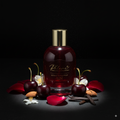 Bottle of Phlame room and textile spray with cherries, flowers, and vanilla beans on a dark background
